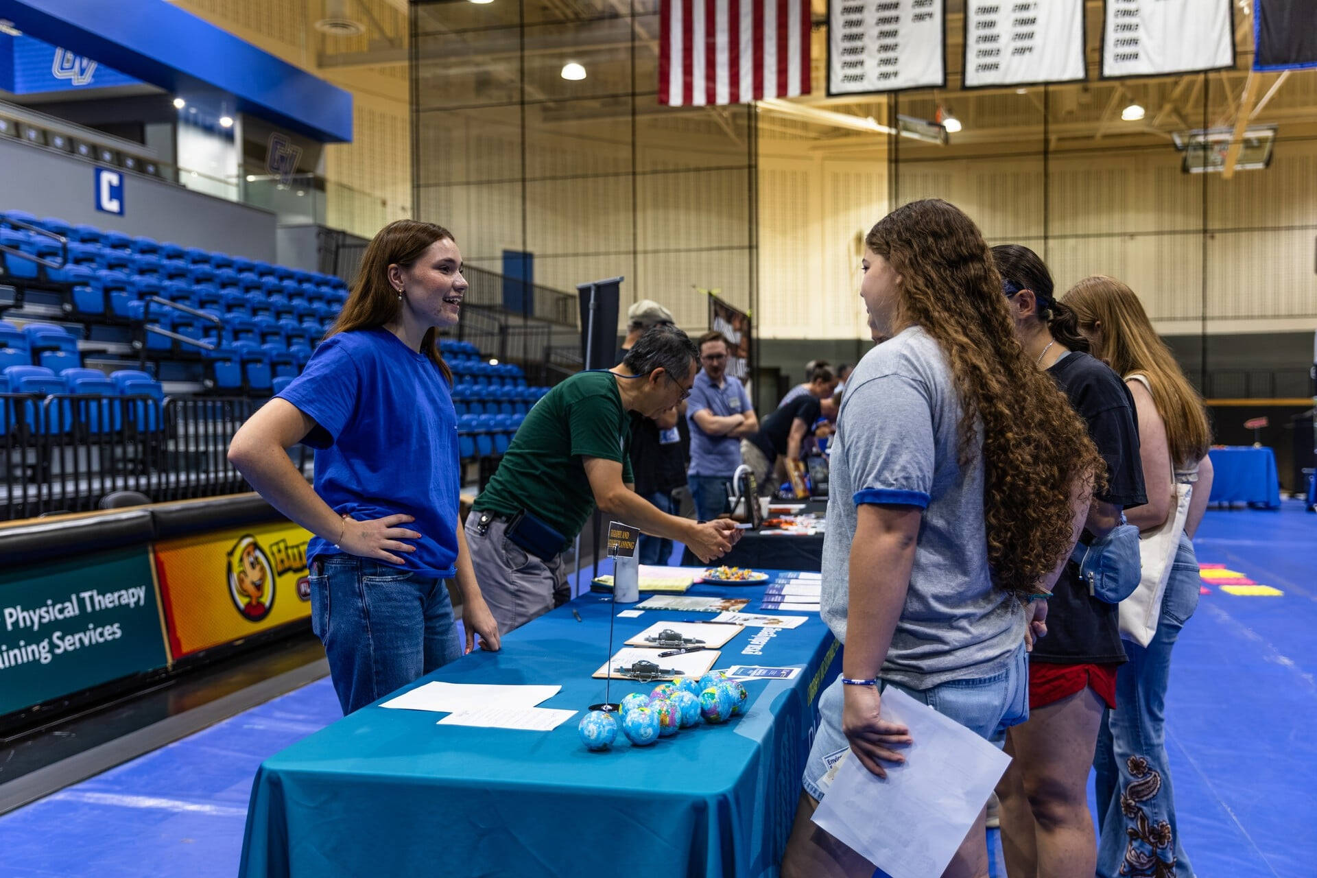 A student talking to other students at the CLAS Welcome Event